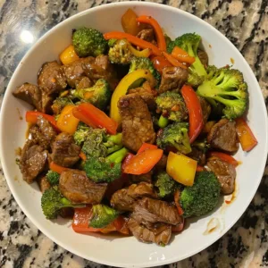 Delicious beef stir fry with colorful vegetables in a bowl