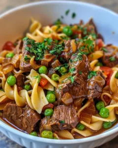 Enjoy delicious Crock Pot Beef and Noodles served in a warm dish