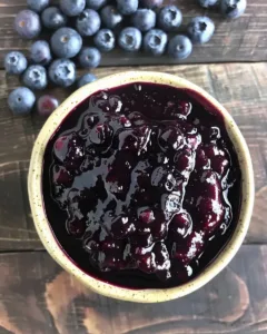 Homemade delicious blueberry sauce served over pancakes