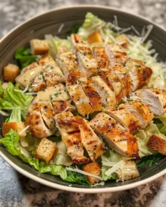Delicious Caesar Chicken served on a plate with fresh ingredients
