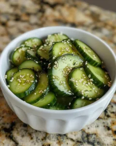 Fresh Japanese cucumber salad with sesame dressing and herbs