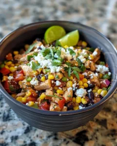 Slow Cooker Street Corn Chicken garnished with cilantro and served in a bowl.