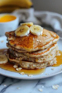 3 Ingredient Banana Oatmeal Pancakes served on a plate