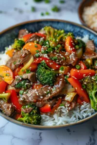 Beef stir fry with colorful vegetables served in a bowl
