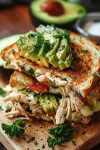 Delicious Chicken Avocado Melt Sandwich with melted cheese and fresh avocado
