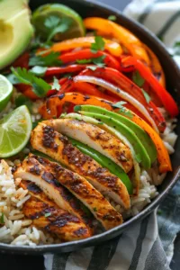 One pan Chicken Fajita Rice Bowl with vibrant vegetables and spices
