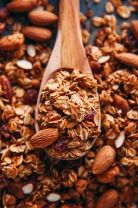 Bowl of homemade healthy granola with nuts and dried fruit
