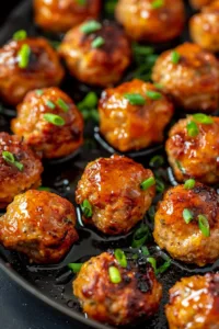 Honey garlic turkey meatballs served with a side of vegetables